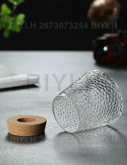 Small transparent glass vase with bamboo base for living room decor