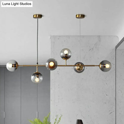 Modern brass and smoke grey glass pendant light dining room