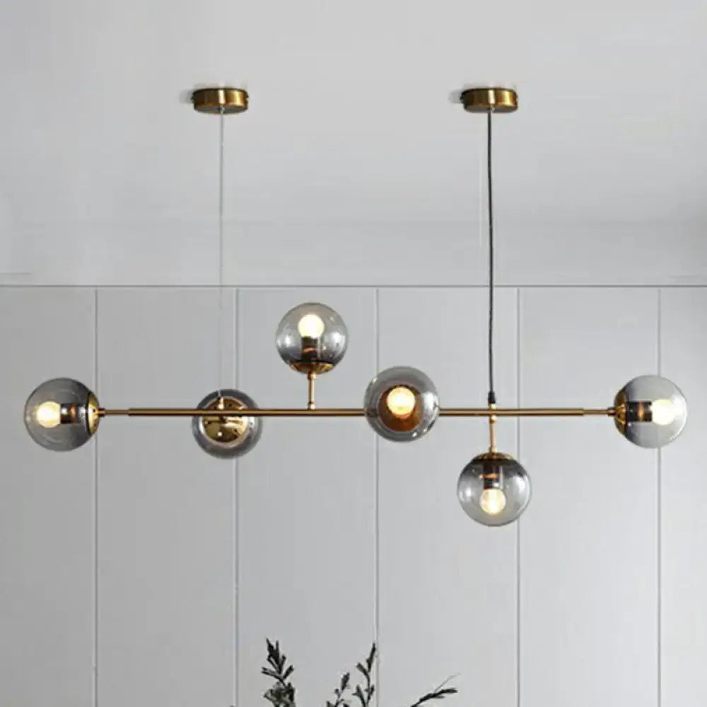 Modern brass and smoke grey glass pendant light dining room