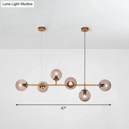 Modern brass and smoke grey glass pendant light dining room