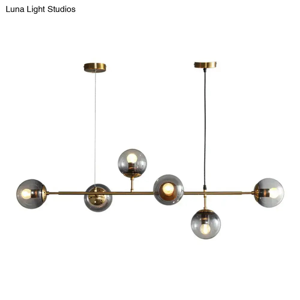Modern brass and smoke grey glass pendant light dining room