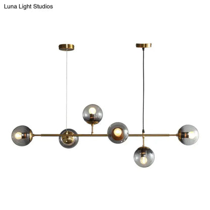Modern brass and smoke grey glass pendant light dining room