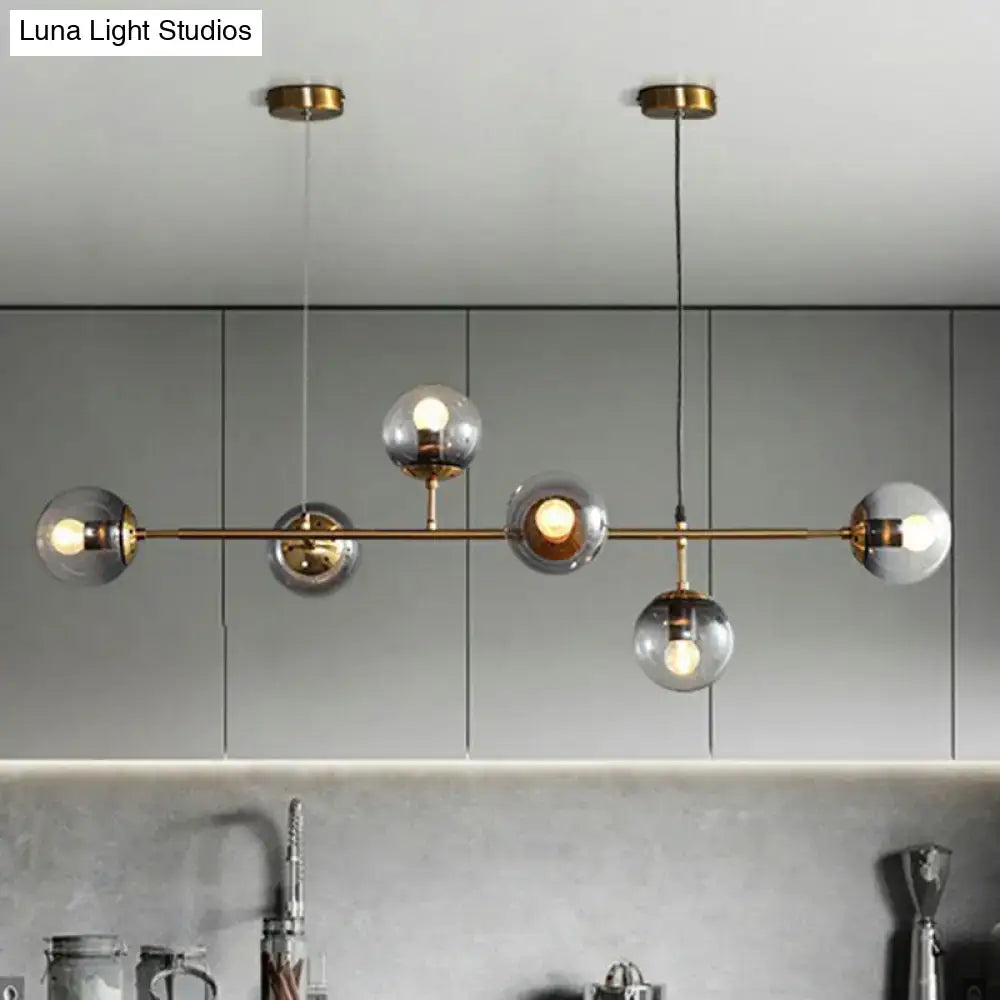 Modern brass and smoke grey glass pendant light dining room