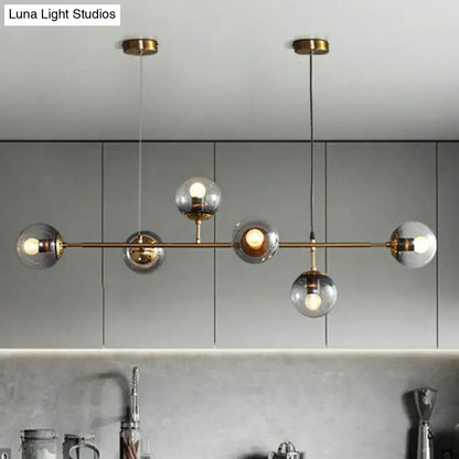Modern brass and smoke grey glass pendant light dining room