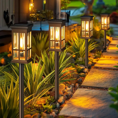 Bronze solar pathway lights warm yellow glass lanterns outdoor garden