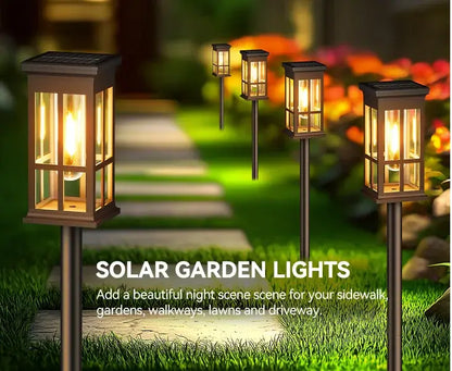 Bronze solar pathway lights warm yellow glass lanterns outdoor garden