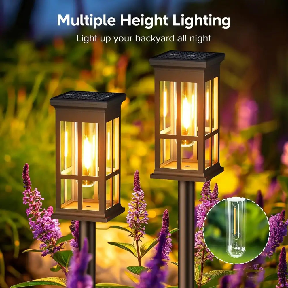 Bronze solar pathway lights warm yellow glass lanterns outdoor garden
