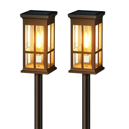 Bronze solar pathway lights warm yellow glass lanterns outdoor garden