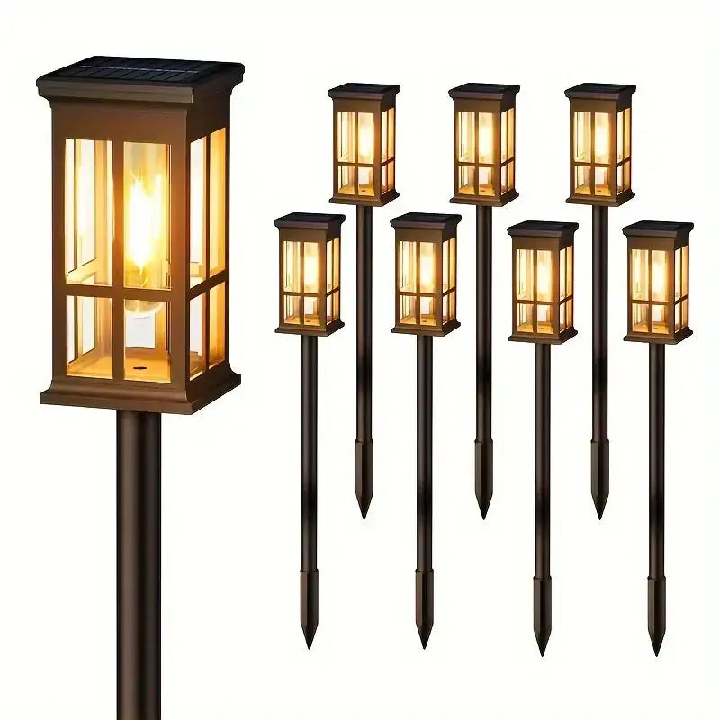 Bronze solar pathway lights warm yellow glass lanterns outdoor garden