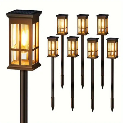 Bronze solar pathway lights warm yellow glass lanterns outdoor garden