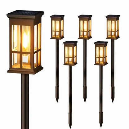 Bronze solar pathway lights warm yellow glass lanterns outdoor garden