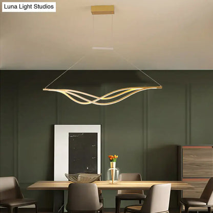 Modern black and gold wave shaped island light fixture dining room