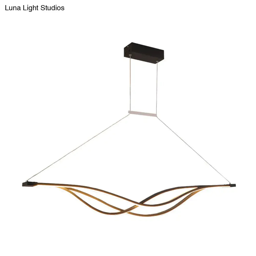 Modern black and gold wave shaped island light fixture dining room