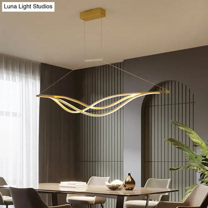 Modern black and gold wave shaped island light fixture dining room
