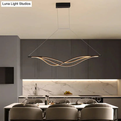Modern black and gold wave shaped island light fixture dining room