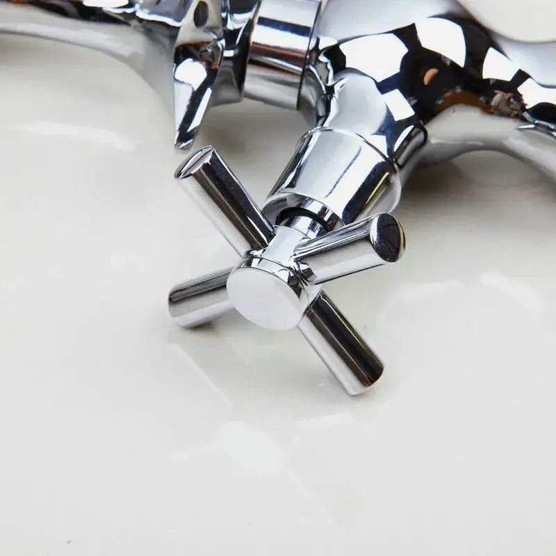 Dolphin shape polished chrome bathroom faucet with dual cross handles