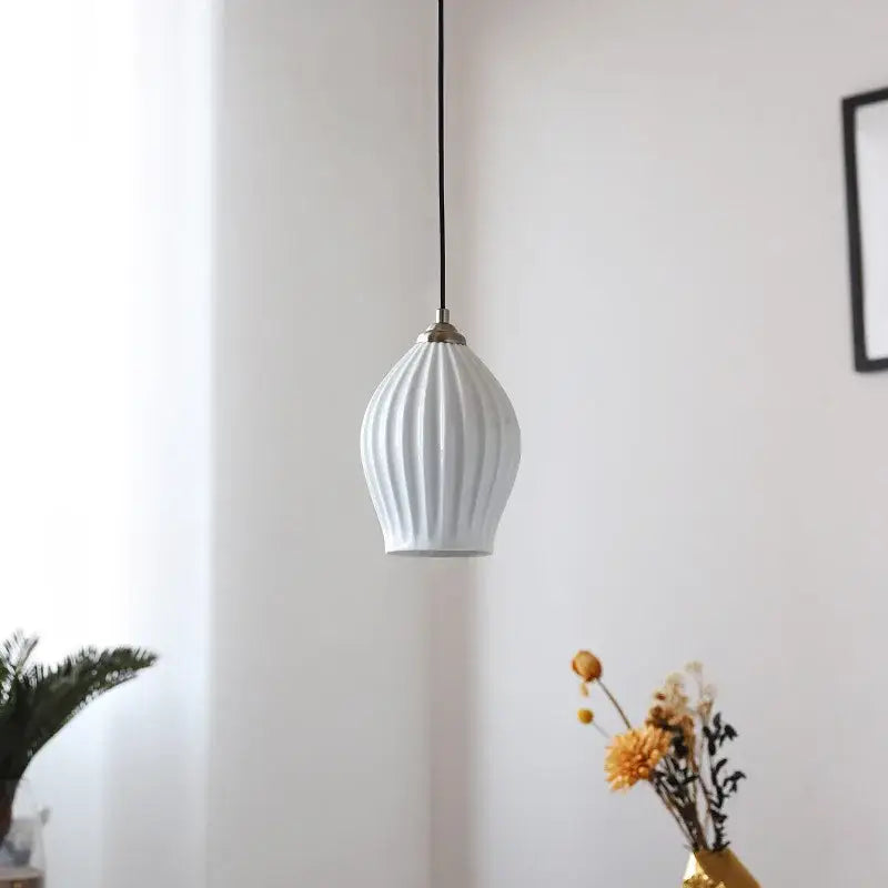 Elegance ribbed ceramic pendant lights in white and gold dining room