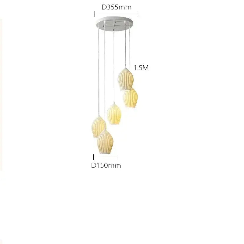 Elegance ribbed ceramic pendant lights in white and gold dining room
