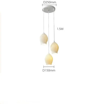 Elegance ribbed ceramic pendant lights in white and gold dining room