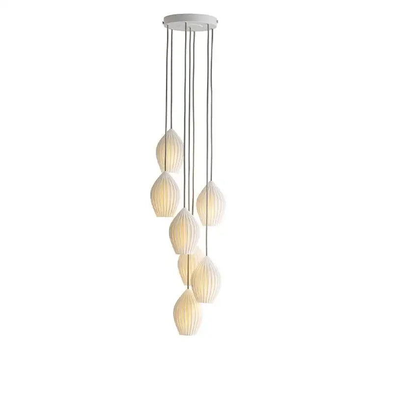 Elegance ribbed ceramic pendant lights in white and gold dining room