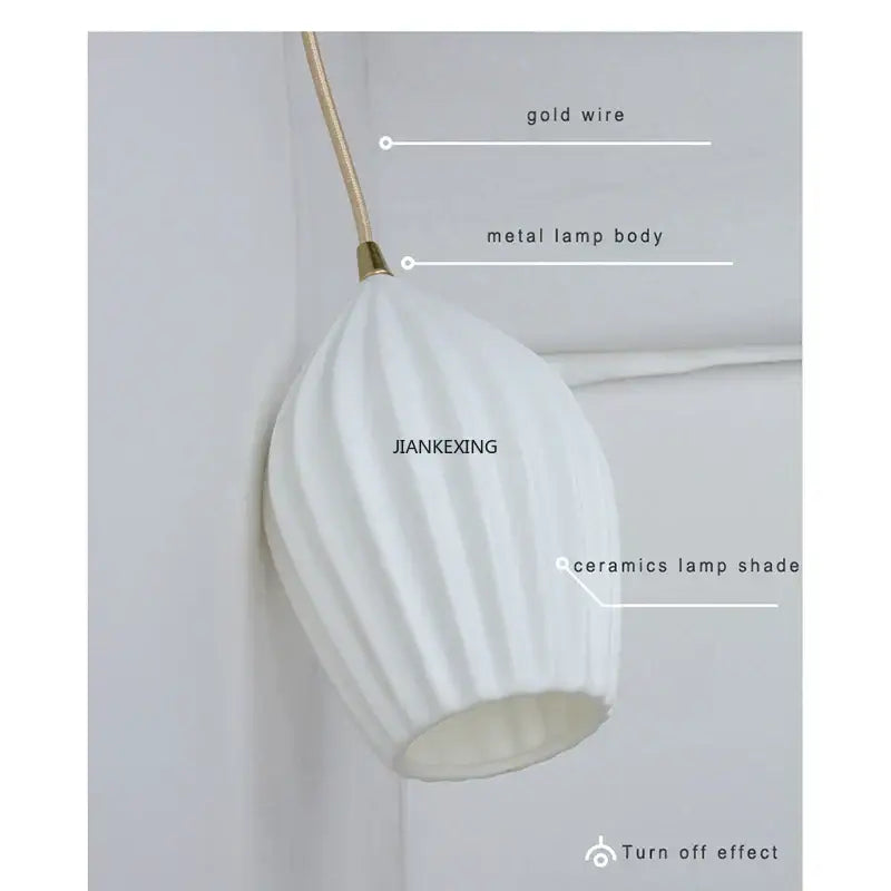 Elegance ribbed ceramic pendant lights in white and gold dining room