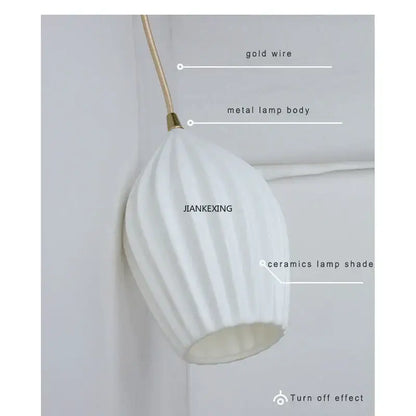 Elegance ribbed ceramic pendant lights in white and gold dining room