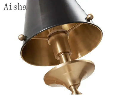 Elegant black & gold wall lamp for bedroom with textured shade