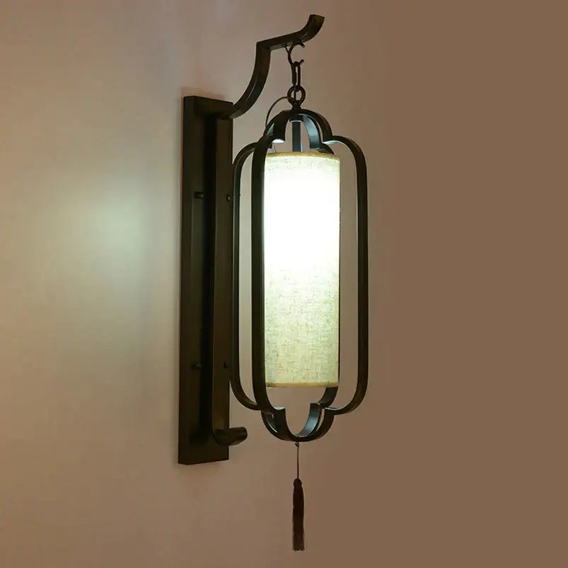 Elegant black wrought iron wall sconce lamp with tassel bedroom light
