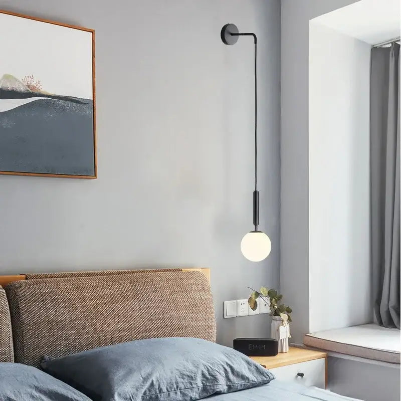 Elegant gold glass wall lamp for living room with frosted globe shade