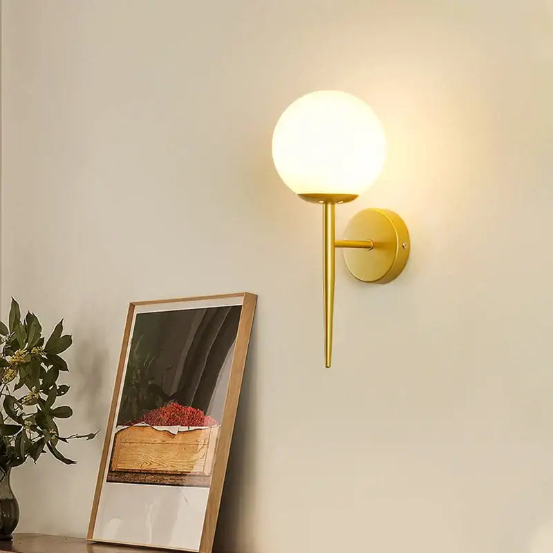 Elegant gold iron wall lamp with frosted glass shade for bedroom