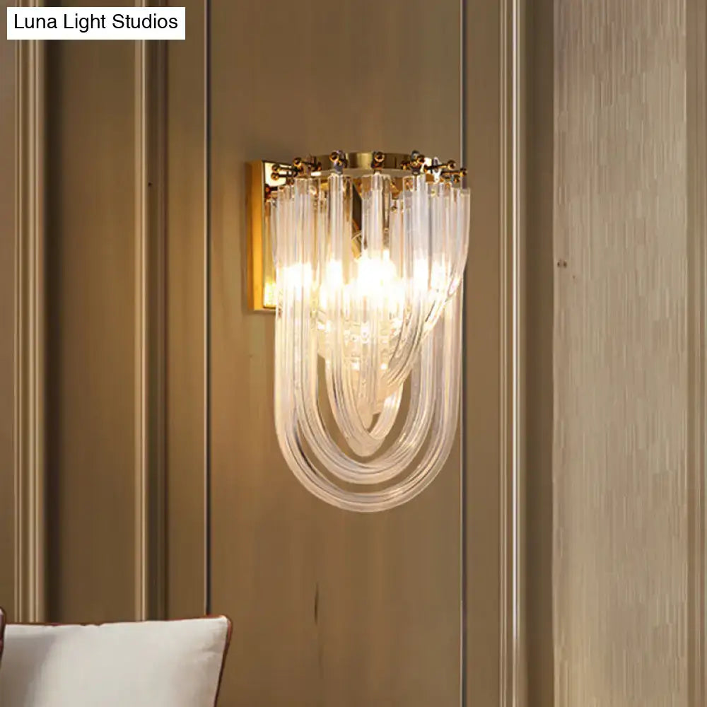 Elegant gold wall lamp with twisted crystal shade for bedroom