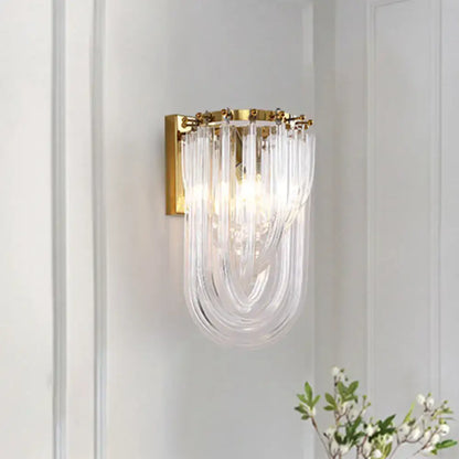 Elegant gold wall lamp with twisted crystal shade for bedroom