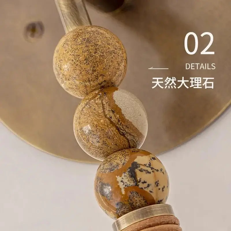 Elegant marble copper wall lamp with brass beads for living room