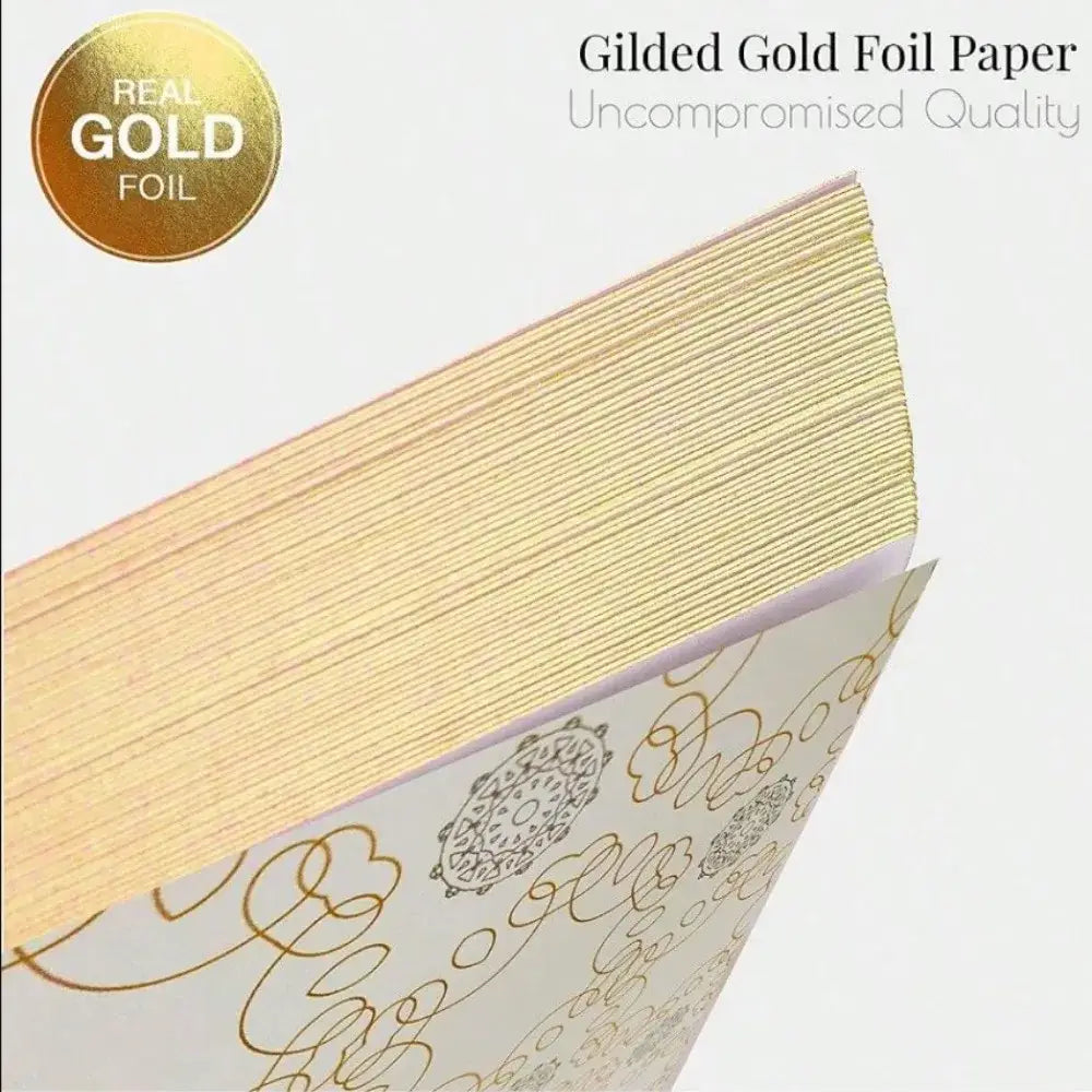 Elegant white guest book with bronzing detail – wedding reception