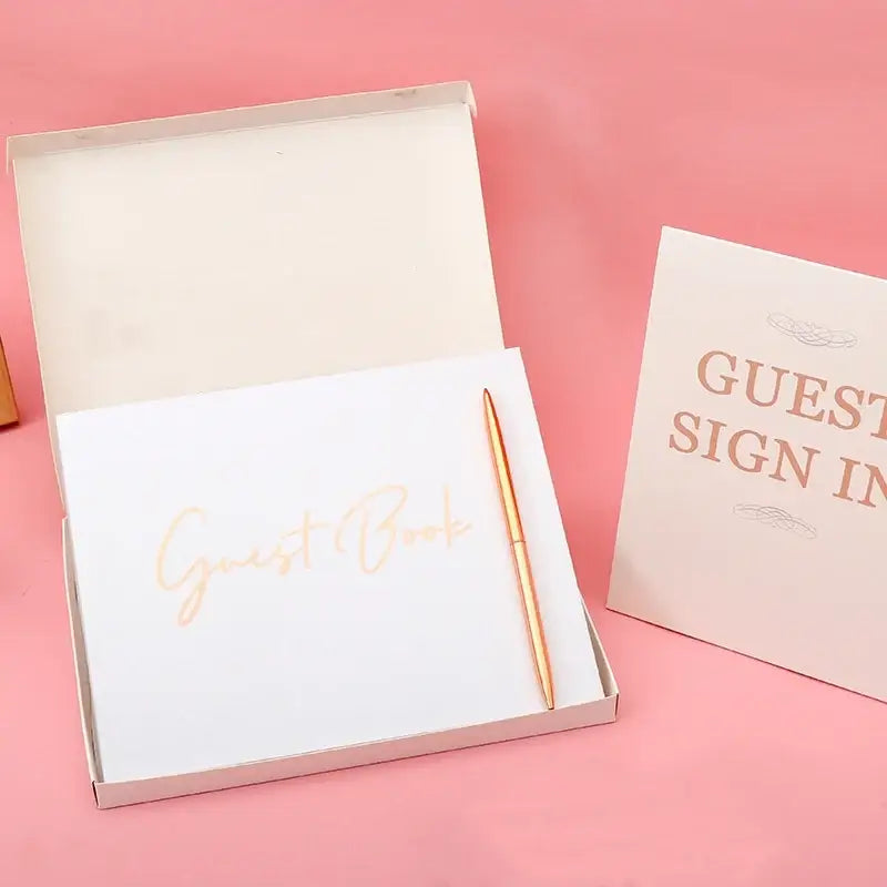 Elegant white guest book with bronzing detail – wedding reception