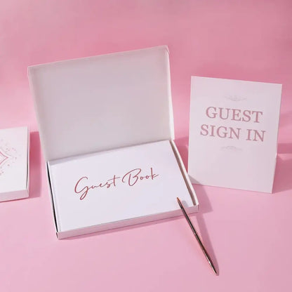 Elegant white guest book with bronzing detail – wedding reception