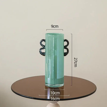 Emerald green glass vase with black handles living room decor