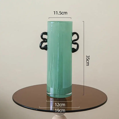 Emerald green glass vase with black handles living room decor