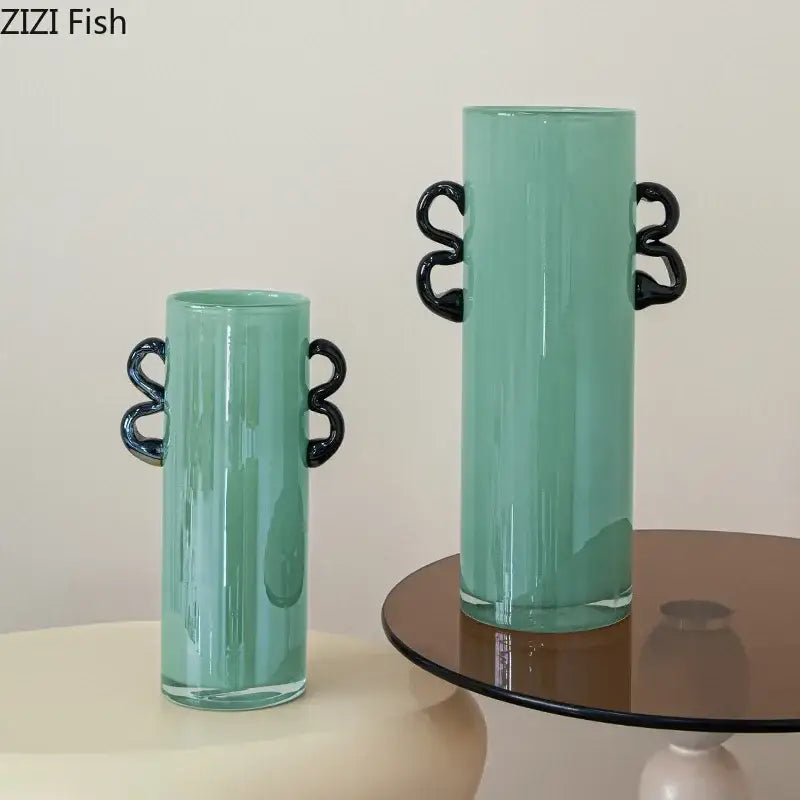 Emerald green glass vase with black handles living room decor