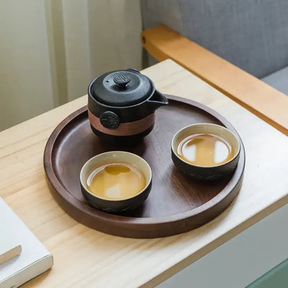 Floral embossed black pottery tea set with travel bag dining room