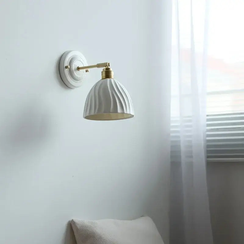Fluted cream ceramic wall lamp with brass accents – bathroom light