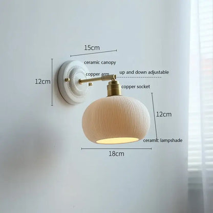 Fluted cream ceramic wall lamp with brass accents – bathroom light
