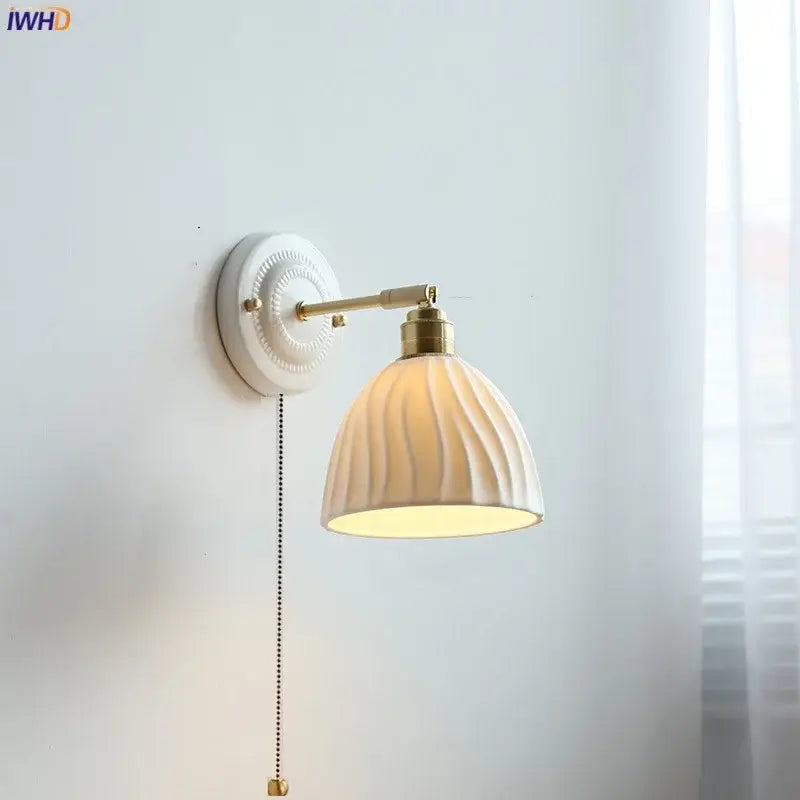 Fluted cream ceramic wall lamp with brass accents – bathroom light