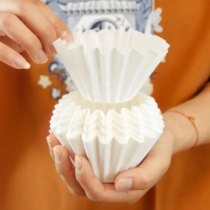 Fluted white disposable paper coffee filters kitchen basket style