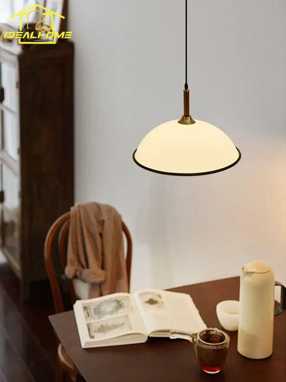 French medieval saucer cream and brass pendant light dining room
