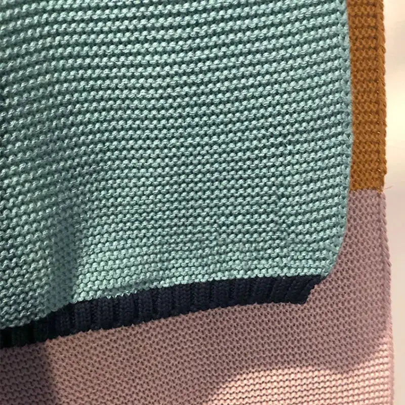 Geometric multicolored knitted chenille blanket bedroom