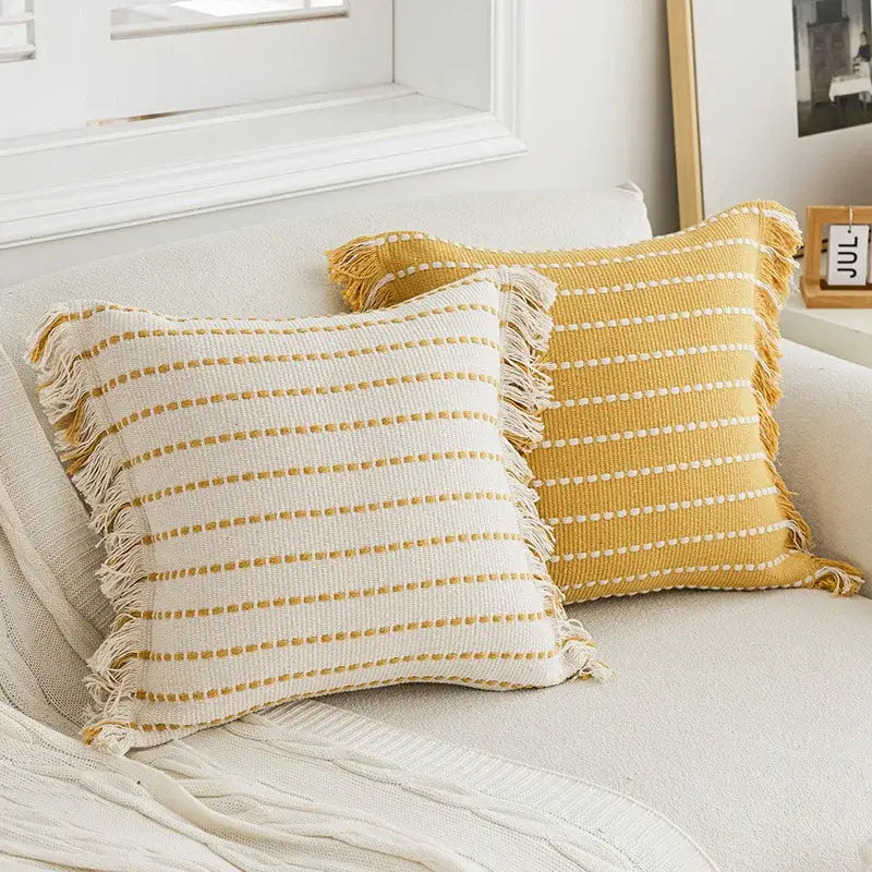 Geometric tufted yellow cushion cover with crochet tassels living room
