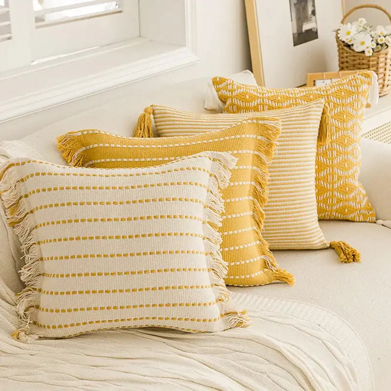 Geometric tufted yellow cushion cover with crochet tassels living room