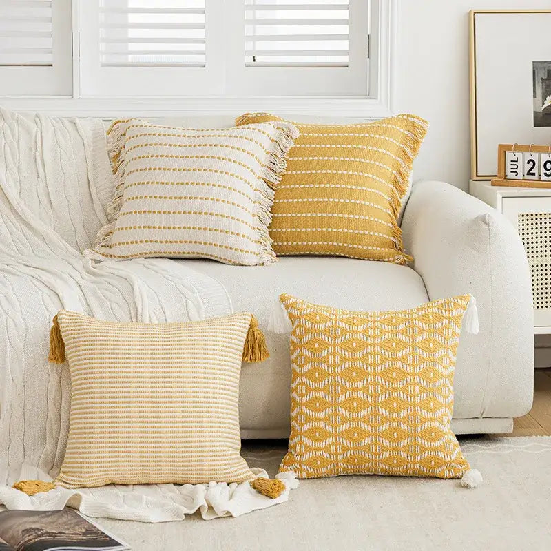 Geometric tufted yellow cushion cover with crochet tassels living room