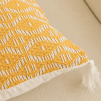 Geometric tufted yellow cushion cover with crochet tassels living room